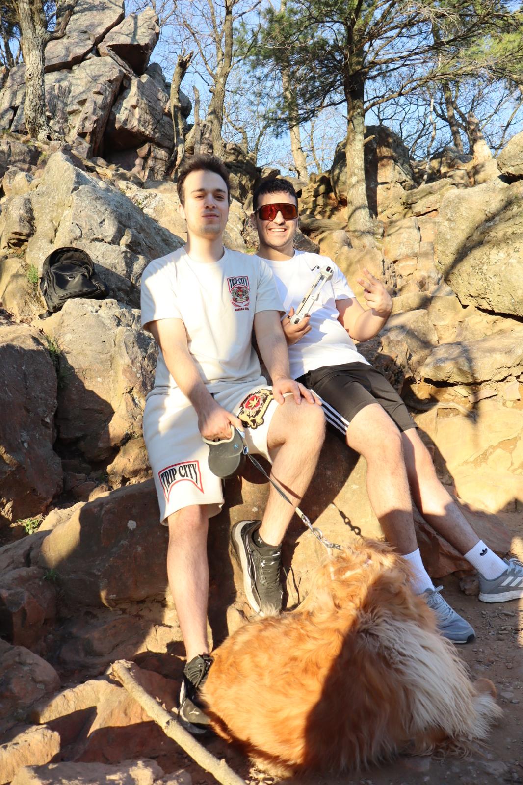 Friends sitting on rocks enjoying the view